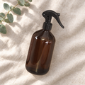 HomeKind amber 500ml trigger spray bottle on linen
