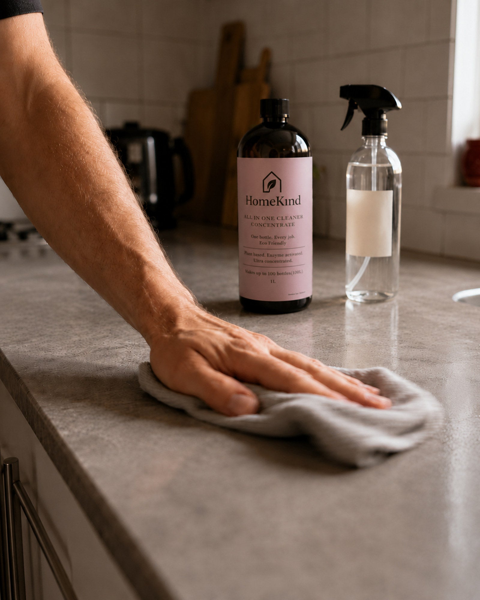 HomeKind being used to clean a kitchen benchtop